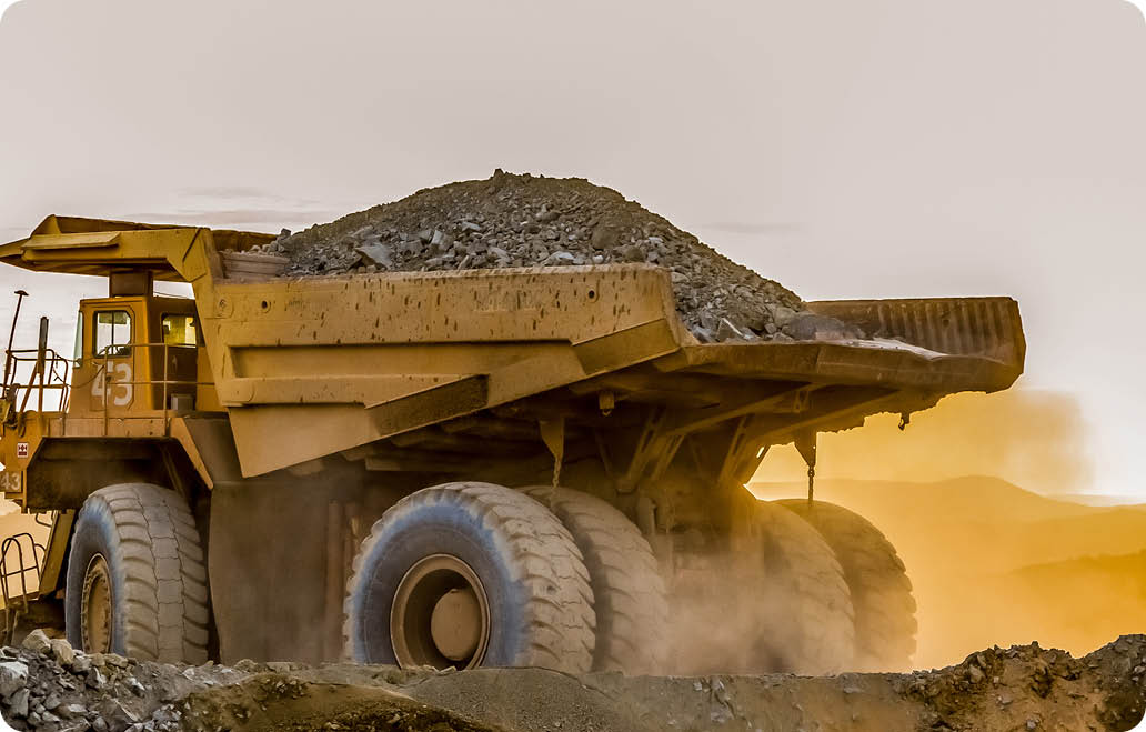 A large truck carrying sand on a platinum mining site in Africa