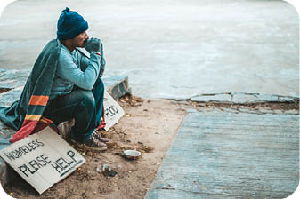 a man sitting beggars with homeless please help message. Selective focus.