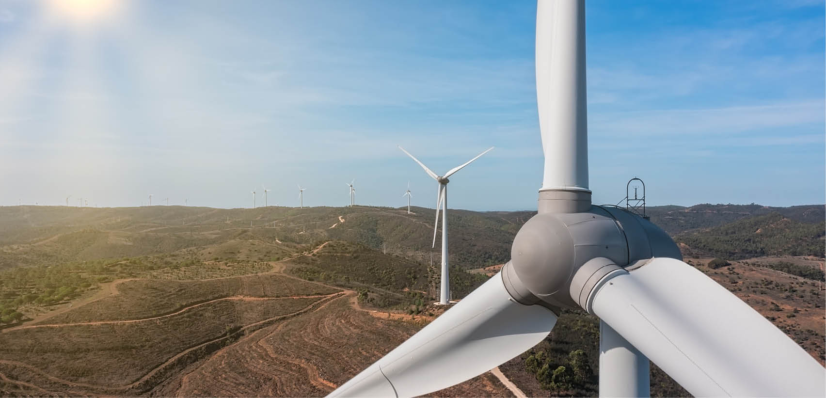 Aerial view wind turbine eco friendly renewable energy concept on Portuguese mountains background. High quality photo