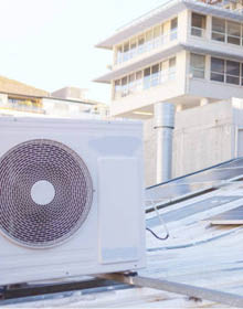 Solar energy, team and tablet on roof planning or focus for sustainability for future of urban city. Engineering team, mobile tech or photovoltaic solar panel for clean eco friendly energy on rooftop