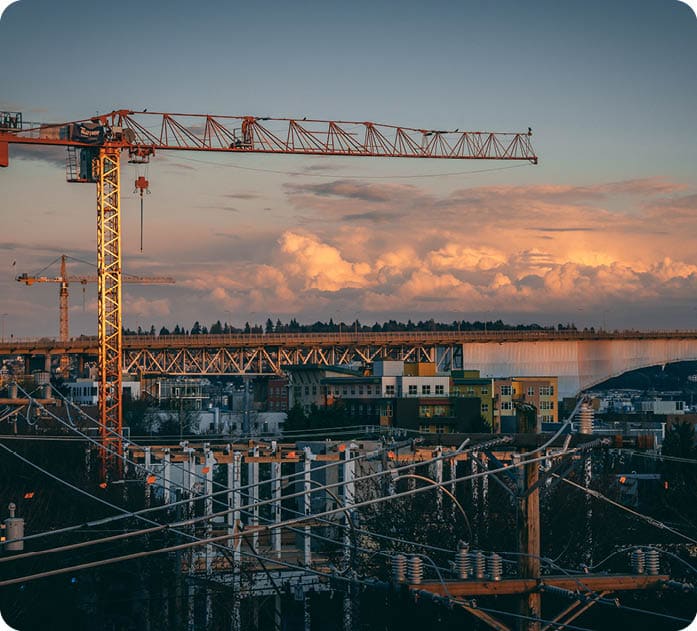 A beautiful view of a construction site in a city during sunset