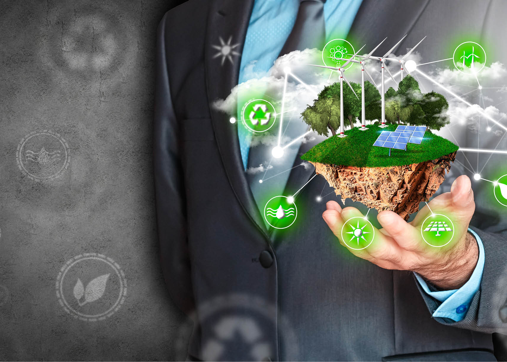 Businessman with island in hand with solar panels, wind fans, trees and clouds. Businessman in energy efficiency concept.