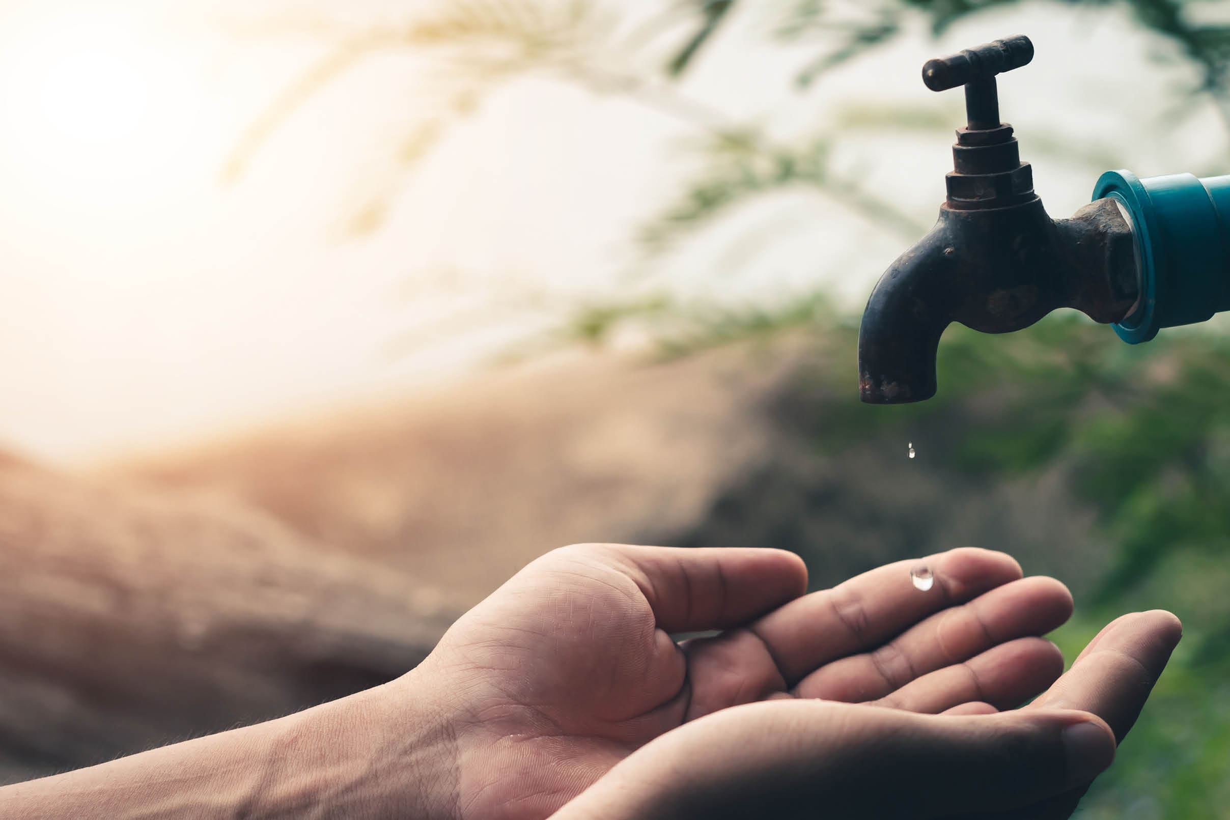 Men hand are waiting to drink water in the water shortage.
