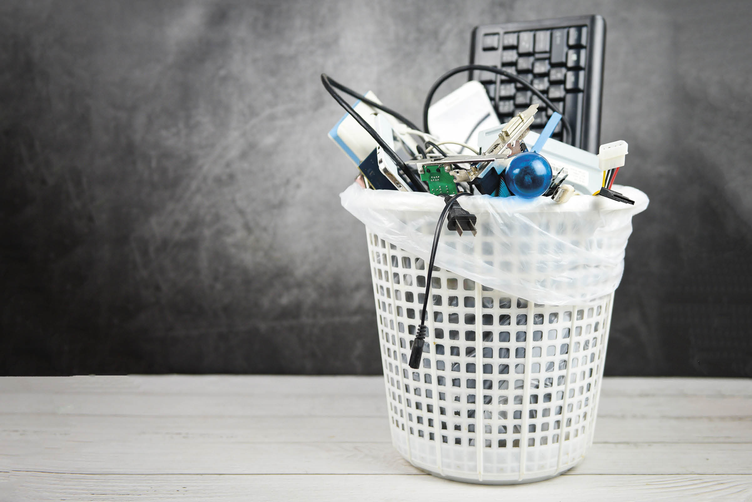 Electronics waste bin concept / Garbage electrical waste ready for recycling , Old devices E-waste disposal management reuse recycle and recovery